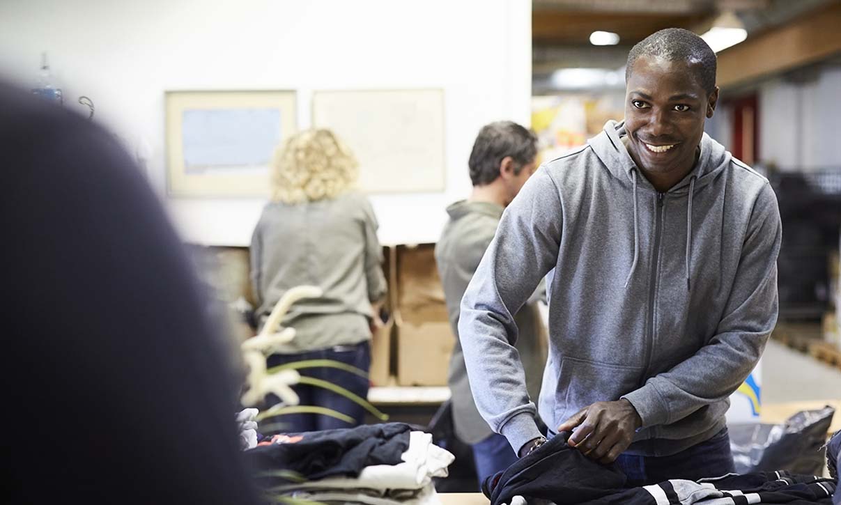 man working a clothing drive