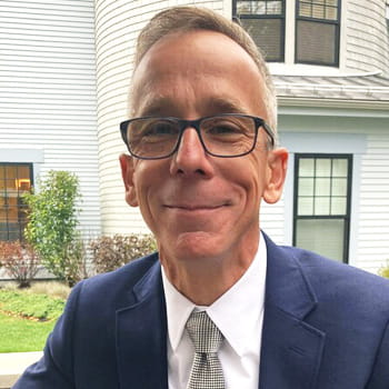 headshot of Geoff Capraro, MD in an outdoor setting