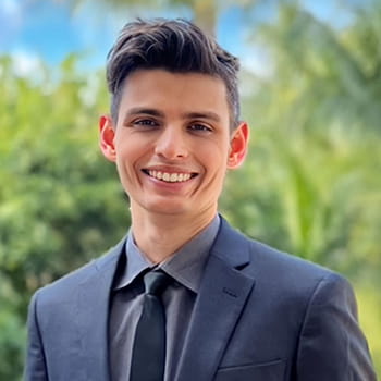 headshot of Jake Pistiner in an outdoor setting