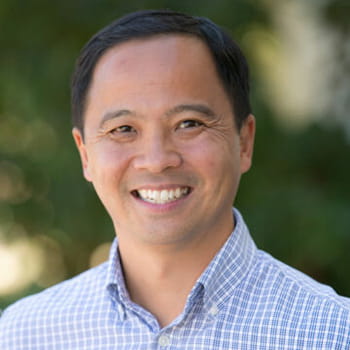 headshot of Ray Cheung in an outdoor setting