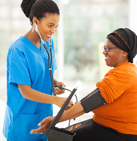 Nurse measuring and elderly woman's blood pressure