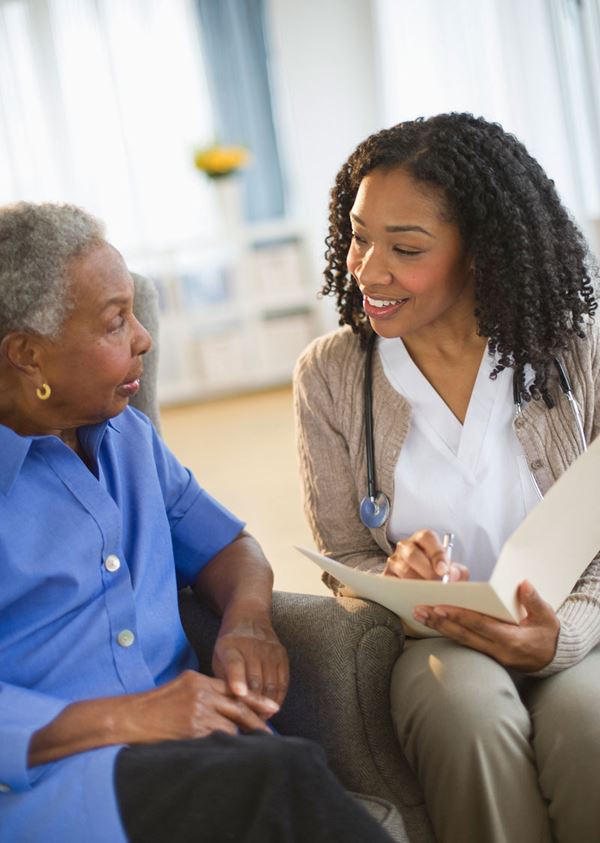 nurse visiting patient at home