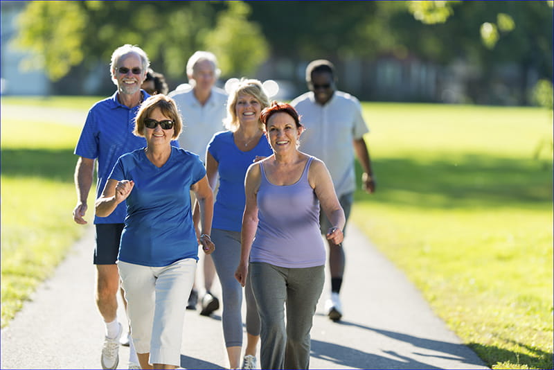 senior Friends exercising outdoors