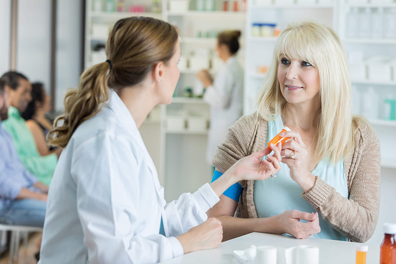 pharmacist with customer