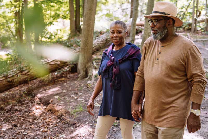 older couple walking in nature