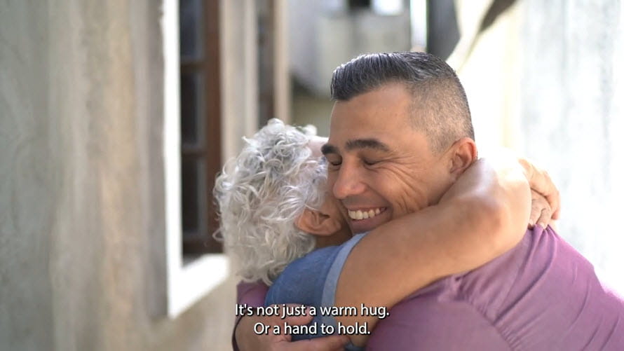 man hugging his grandmother