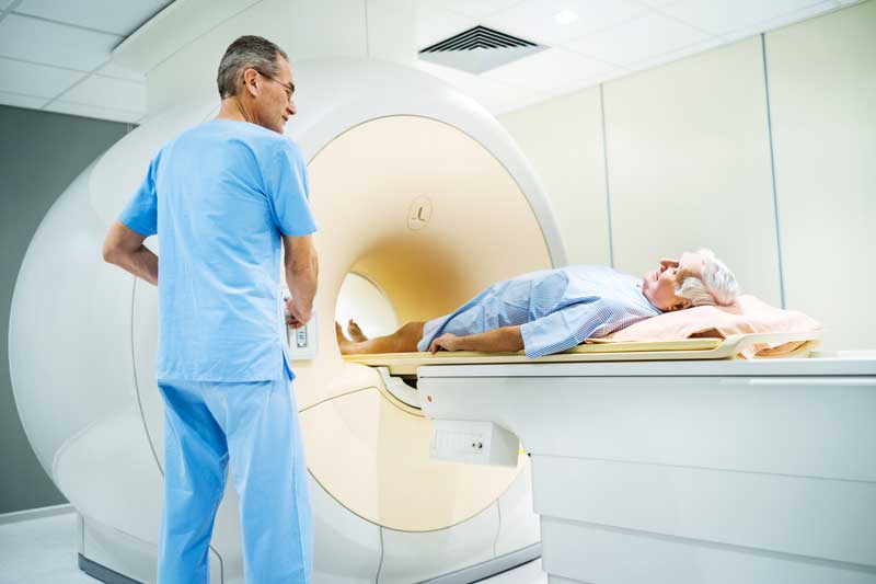 man going into MRI