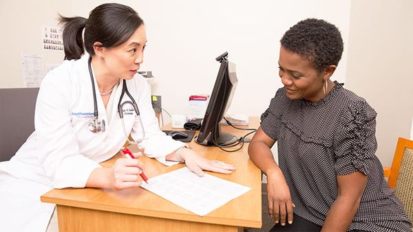 Doctor reviewing labs with patient Doctor reviewing labs with patient