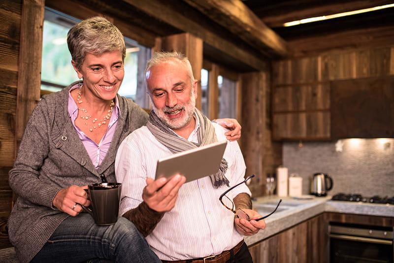 couple checking laptop