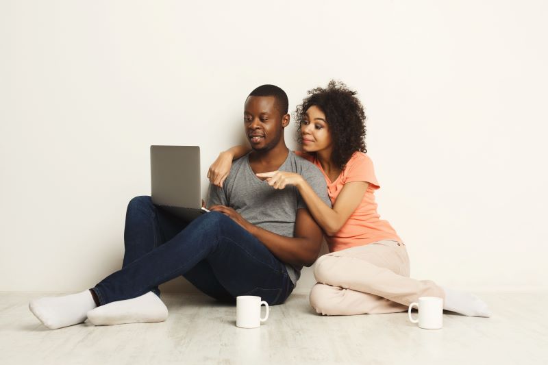 Couple looking at a laptop together