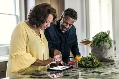 Older Couple Looking at Tablet
