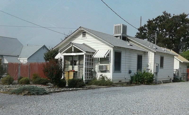 White house on gravel road