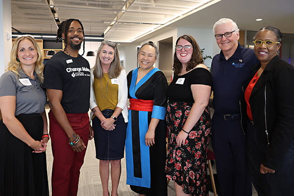 The group of 2023 ETS Minnesota Business Accelerator candidates are posing for the camera at the finale
