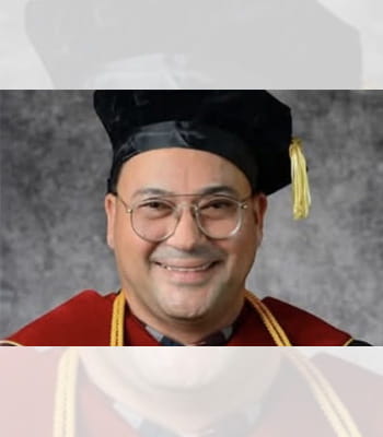 A professional headshot of Dr. Joel Acevedo in his academic regalia. A professional headshot of Dr. Joel Acevedo in his academic regalia.