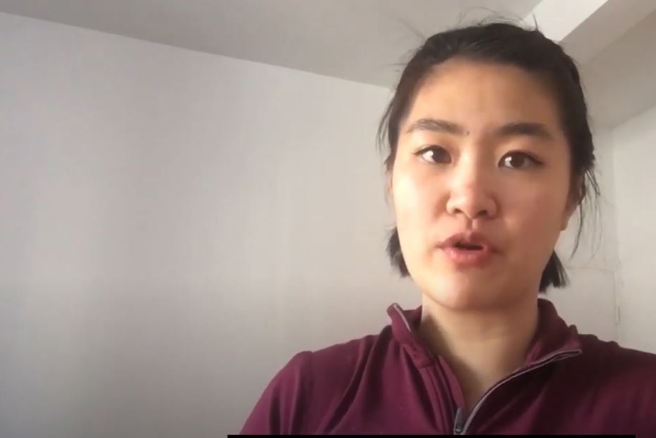 A video frame of Trista Li in a room with white walls.