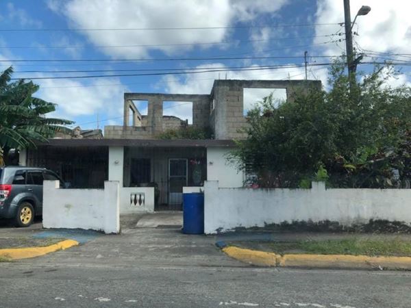 White house with brown roof