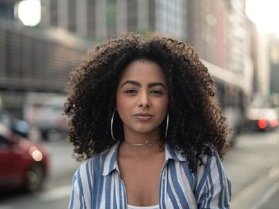 woman standing on a street corner